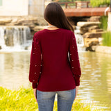 Maroon top with pearl long sleeves