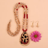 Crystal beaded necklace with leopard and red glitter teardrop pendant