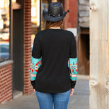 Black top with turquoise tribal stripe