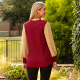 Maroon textured top with tan long sleeves