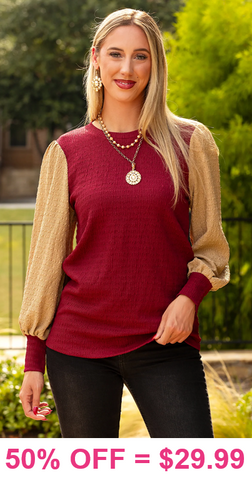 Maroon textured top with tan long sleeves