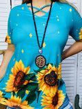 Turquoise top with sunflowers