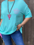 Turquoise tee with smiley cowgirl hat graphic