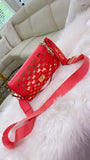 Coral MK crossbody with gold accents