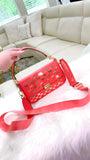 Coral MK crossbody with gold accents