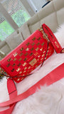 Coral MK crossbody with gold accents