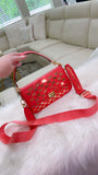 Coral MK crossbody with gold accents