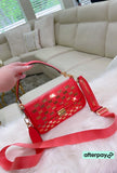 Coral MK crossbody with gold accents