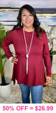 Maroon tunic top with shark bite hem