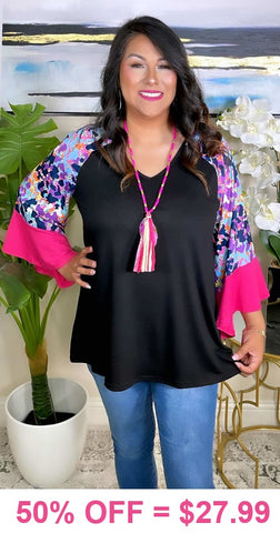 Black Top with purple leopard bell sleeves and pink ruffle trim