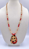 Crystal beaded necklace with leopard and red glitter teardrop pendant