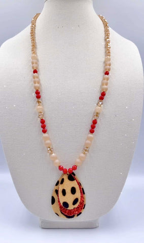 Crystal beaded necklace with leopard and red glitter teardrop pendant