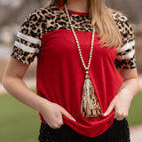 Pearl necklace with red shimmer, leopard tassel