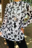 Black and White cow print top with sheer long sleeves